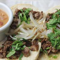 Mini Tacos · Four mini tacos, with your choice of meat, onions, cilantro, and charro beans.