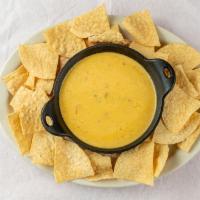 Chips And Queso · Our delicious queso is homemade from scratch.