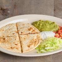 Sincronizada · Ham and cheese quesadilla between two flour tortillas. Served with lettuce, tomato, guac, an...