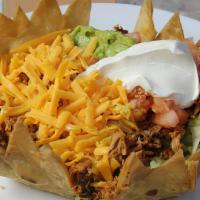 Taco Salad · Large flour tortilla fried into a bowl and filled with beef or chicken, sour cream, cheese, ...