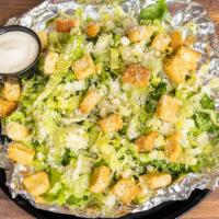 Caesar · Fresh Cut Romaine Lettuce, Parmesan Cheese, Homemade Croutons, Tossed with Caesar Dressing