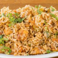 Chicken Biriyani · Chicken cooked with rice and aromatic spices.
Served with Raita