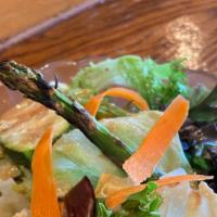 Grilled Vegetable Salad · Fresh greens dressed in creamy dressing and topped with savory grilled zucchini, eggplant, a...