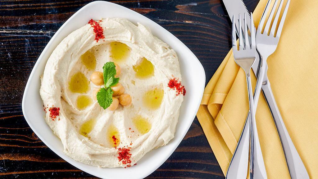 Hummus · Vegetarian. Vegan. Chickpea purée, Lebanese tahini, lemon, olive oil.