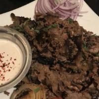 Kufta Kabob · Grilled spiced ground beef, parsley, sumac onions.