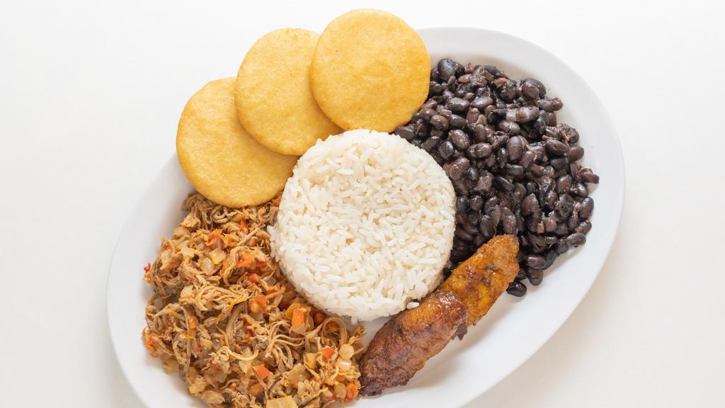 Pabellon · Shredded beef served with black beans, white rice and sweet plantains.