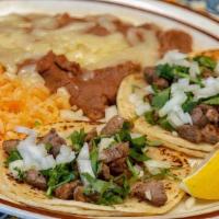 Street Tacos · 3 mini corn tortillas topped with your choice of asada, shredded chicken or shredded beef, t...
