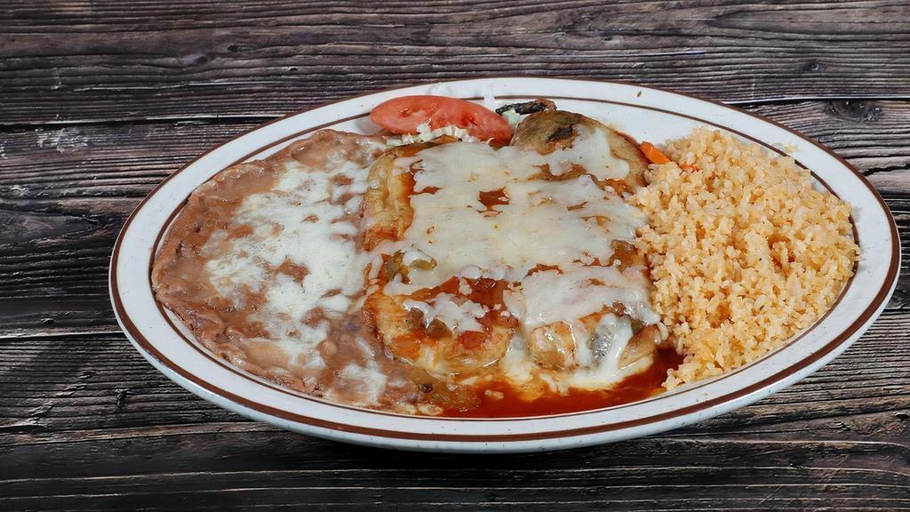 Chile Rellenos · Two egg battered California long chile peppers stuffed with Monterey Jack cheese and topped with relleno sauce