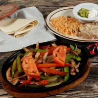 Fajitas De Pollo · Grilled chicken, bell peppers, onions, & tomatoes