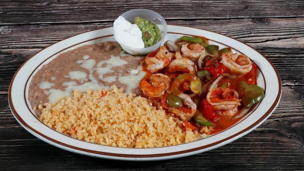 Fajitas De Camaron · (8) large shrimp, bell peppers, onions, tomatoes with a light sauce