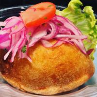 Papa Rellena · Papa Rellena is a traditional croquette filled with a low spicy pulled chicken mixture. Roti...