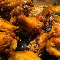 Chicken Wings With Sauce · 10 pieces.