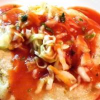 Pupusa Loca · eight inch handmade corn tortilla slowly cooked filled with chicken, cheese, beans, pork and...