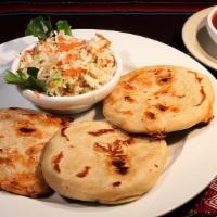 Pupusa De Frijol, Queso, Y Loroco · filled with cheese, beans and loroco flowers