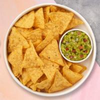 Guacamole & Chips · A heaping scoop of fresh guacamole and tortilla chips.