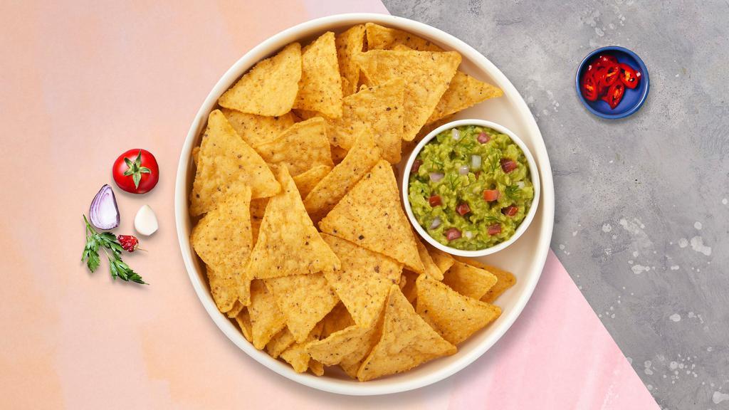 Guacamole & Chips · A heaping scoop of fresh guacamole and tortilla chips.