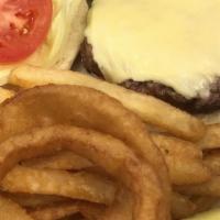 Cheeseburger Deluxe · Deluxe burgers are served with french fries, onion rings, lettuce & tomato.