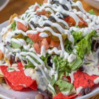 Ultimate Nachos · Choice of pulled chicken, roco brisket, pulled pork, chill or black beans, topped with queso...