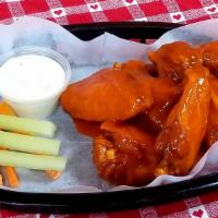 Buffalowings   · 8 Medium heat. Jumbo Bone-in wings, served with ranch or blue cheese, carrots, and celery.
