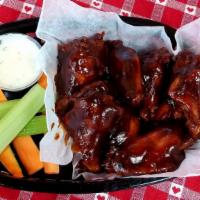 Bbq Wings · 8 Mild heat. Jumbo Bone-in wings, served with ranch or blue cheese, carrots, and celery.