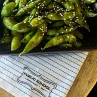 Ginger Sesame Edamame · charred whole pod edamame, ginger, garlic & soy garnished with sesame seeds