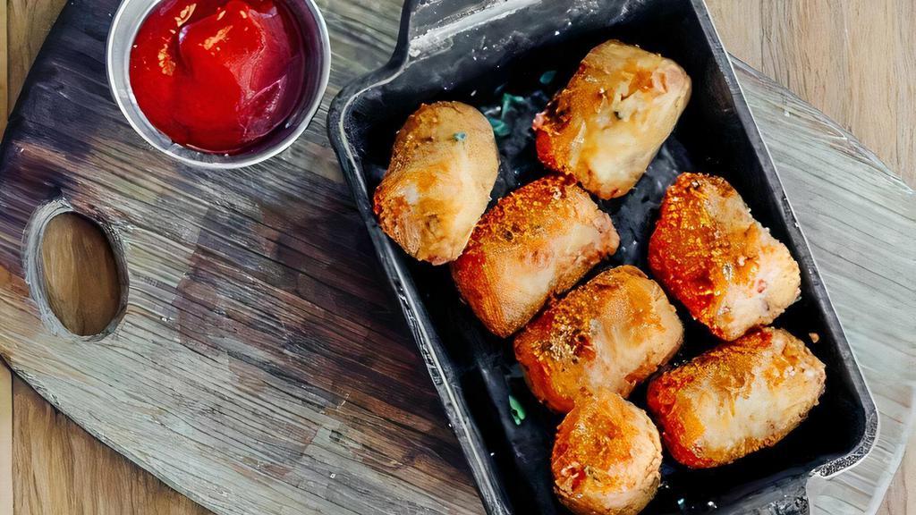 Tater Tots · Sriracha ketchup.  Add a side of beer cheese for an additional charge.