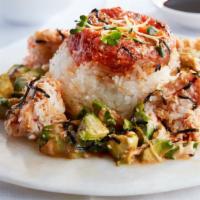 Mini Ahi Tower · Spicy tuna, crab mix, avocado, sushi rice, eel sauce, spicy mayo, wasabi mayo, dried seaweed...