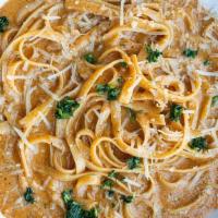 Kid'S Fettuccini Alfredo · Alfredo sauce satuéed with buttered noodles (not spicy).