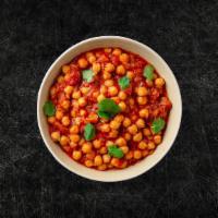 Chickpea Masala (Vegan) · Whole chickpeas, slow cooked till soft in an onion and tomato curry with Indian whole spices