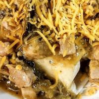 Green Pork Verde Smothered Burrito · Fresh tortilla stuffed full of scrambled eggs and our signature hash browns topped with perf...