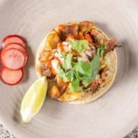 Chicken Taco · Soft corn tortillas, guacamole, salsa, onions, cilantro, radish, lime.