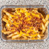 Cheese Fries With Bacon · Nacho cheese and bacon topping.