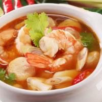 Tom Yum · Thai hot soup with Kaffir Lime, Galangal, Lemongrass, Mushrooms, Onions, Cilantro, and Tomato.