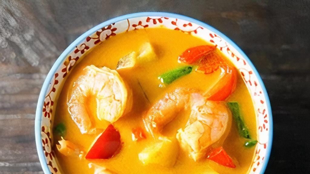 Pineapple Curry · Red Curry with coconut milk, Pineapple, Bell Peppers, Onions, Basils, Tomato.
