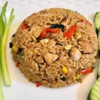 Spicy Basil Fried Rice · Onion, bell pepper, basil, tomato, (with egg on top).