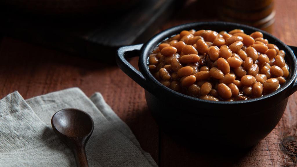 Bbq Beans With Bacon · Smoked bacon slow-simmered in a sweet BBQ sauce with tender beans and a blend of spices.
