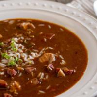 Chicken & Smoked Sausage Gumbo · A hearty portion of old fashioned Dark Roux gumbo, served over steamed white rice.