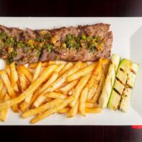 Churrasco Steak With Chimichurri · Grilled 10oz flank steak served with Chimichurri sauce & parmesan fries.