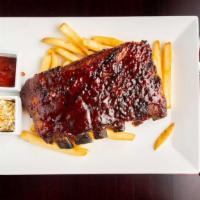 1/2 Rack Baby Back Ribs · Slow roasted St. Louis ribs slathered with BBQ, fire grilled with fries & slaw.