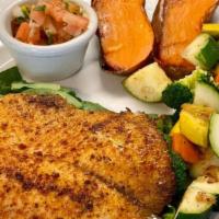 Tilapia Salad · Served on top of our organic greens salad. 598 calories, 41 grams of protein, 8 grams of fib...