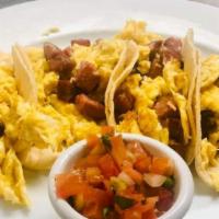 Breakfast Tacos · Traditional Texas tacos with a choice of egg and potatoes, egg and ham, egg and beans, egg a...