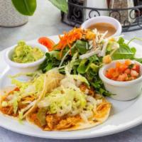 Spicy Chicken Tacos · Two corn tortillas filled with low fat mozzarella cheese, shredded spicy chicken breast, rom...