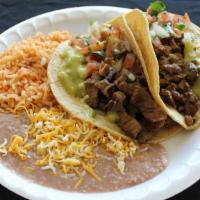#8 2 Carne Asada Tacos · Two carne asada tacos topped with guacamole and pico De gallo. Served with rice and beans.
