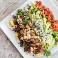 Cobb Salad · flamebroiled chicken breast, bacon, avocado, tomato, romaine, field greens, gorgonzola, hard...