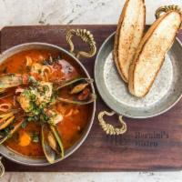Seafood Cioppino · salmon, shrimp, mussels, bay scallops, calamari, tomato, lobster broth, crostini