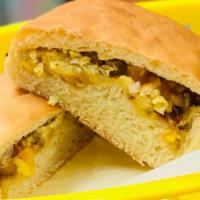 Breakfast Bomb · Breakfast kolache has bacon, sausage, egg and cheese wrapped in warm soft bread.