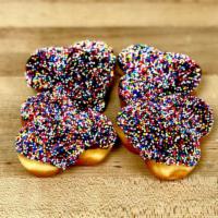 Chocolate Sprinkled Donut Holes · 3 holes stuck together and dipped in chocolate. You get 4 clusters. Pull apart and enjoy!