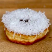 White Coconut · Raised donut with white icing and shaved coconut