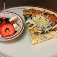 Spinach & Mushrooms Quiche · Served with a bowl of fruit.