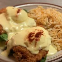 Benny Benedict · Two poached eggs on an English muffing with spinach, fried chicken, smothered with hollandai...